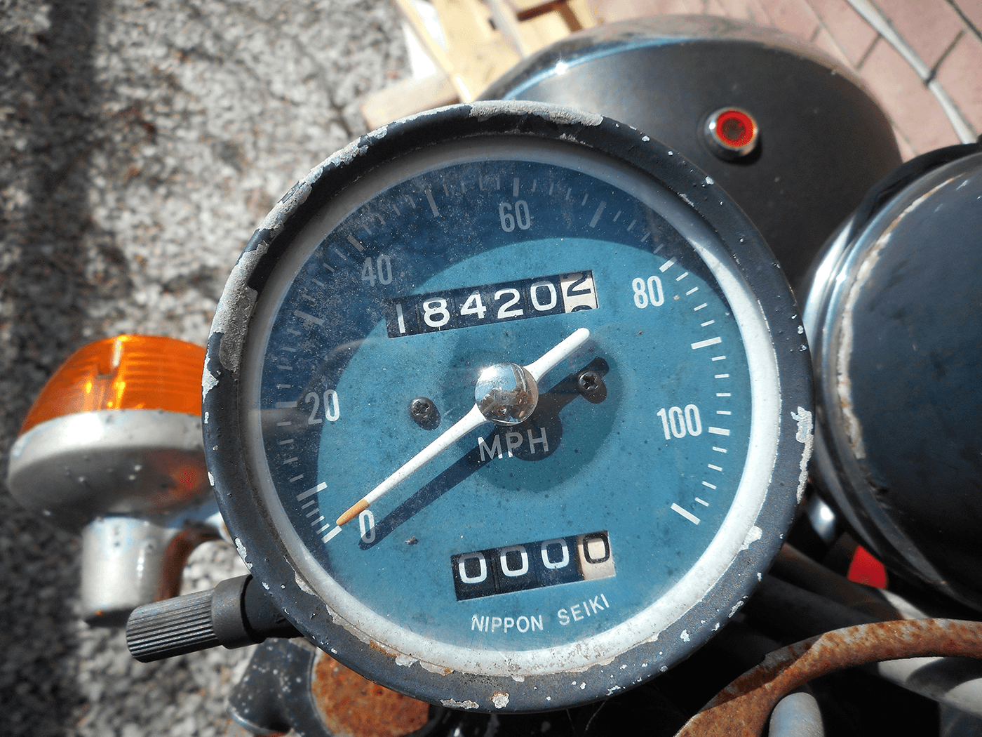 Website speed is being represented by an old motorcycle spedometer.